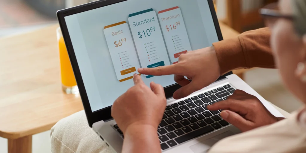 Family members reviewing multiple subscription options on a laptop screen